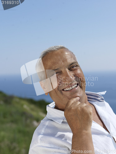 Image of senior man sitting outside