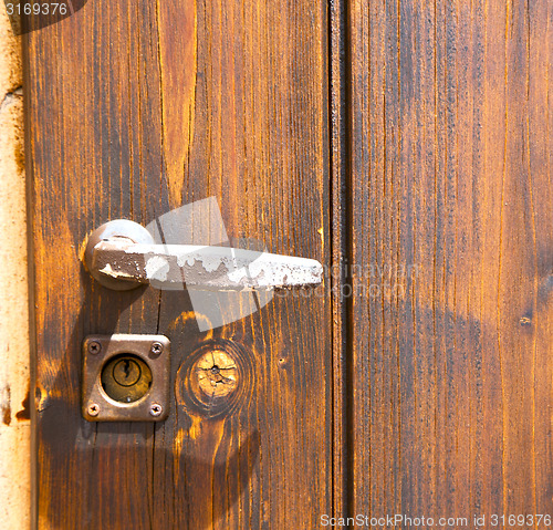 Image of jerago abstract   rusty brass  knocker in a   