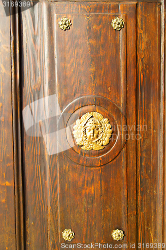 Image of gold face  house  door     in italy  