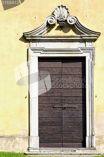 Image of grass arsago seprio   knocker in a  door curch  closed wood ital