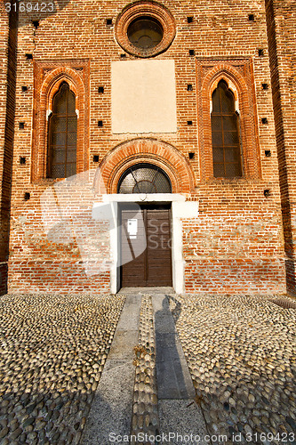 Image of  church  in  the parabiago  old   closed brick  sidewalk italy  