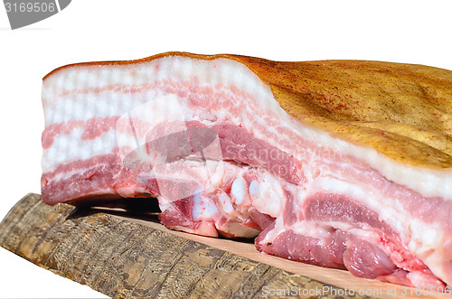 Image of A piece of bacon in a cut on a wooden board