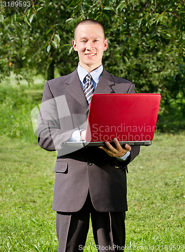 Image of Man working outdoors as a freelancer