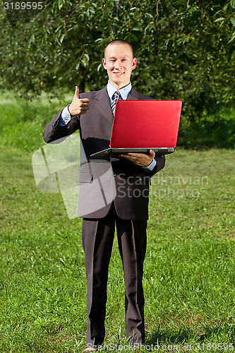 Image of Man working outdoors as a freelancer