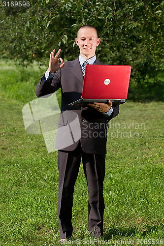Image of Man working outdoors as a freelancer