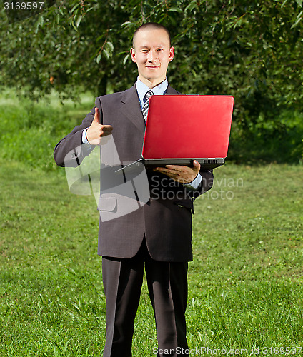 Image of Man working outdoors as a freelancer