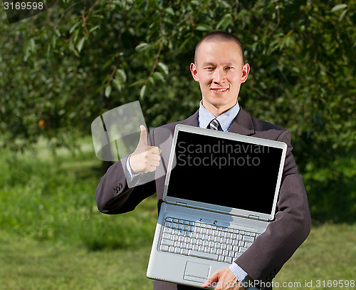 Image of Man working outdoors as a freelancer