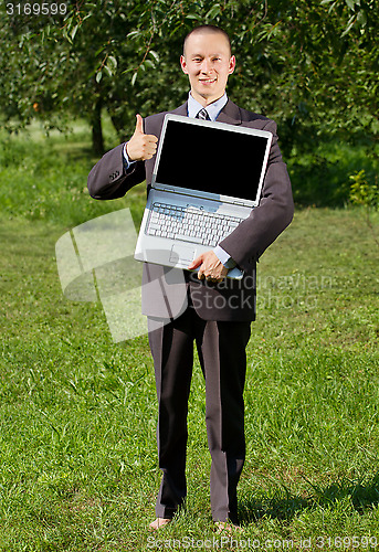 Image of Man working outdoors as a freelancer