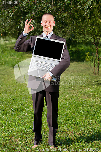 Image of Man working outdoors as a freelancer