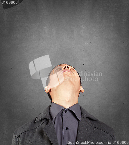 Image of Businessman Looking Upwards