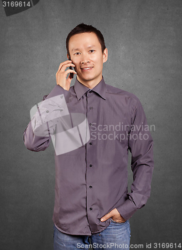 Image of Asian Man With Folded Hands