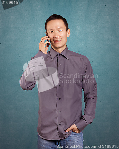 Image of Asian Man With Folded Hands