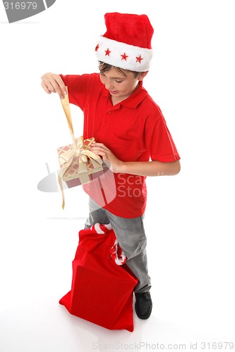 Image of Boy opening Christmas present