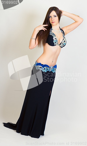 Image of young woman a performing belly dancing. full height