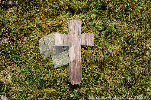 Image of Easter wooden cross on grass