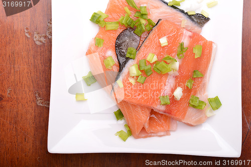 Image of salmon filet with fresh herbs