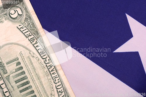 Image of dollars on american flag