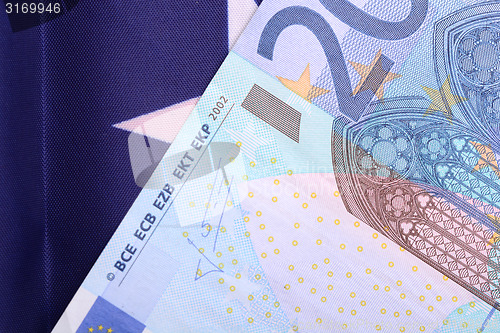 Image of european money on american flag
