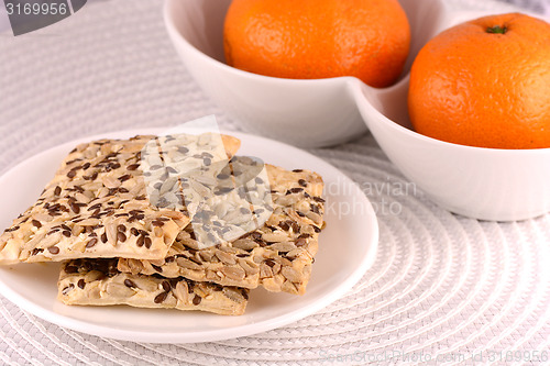 Image of sweet cake on white plate and fruits