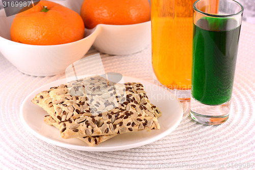 Image of sweet cake on white plate and fruits