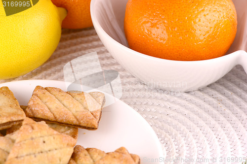 Image of sweet cake on white plate and fruits