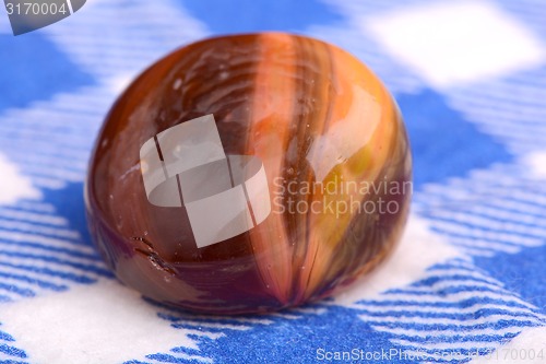 Image of Close up stone on white and blue material