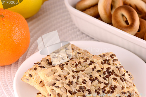 Image of sweet cake on white plate and fruits