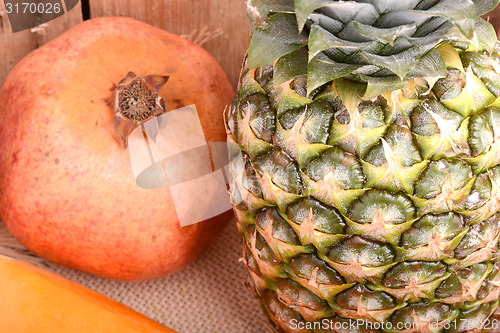 Image of fresh pineapple with corn and orange