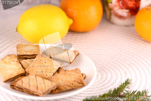 Image of sweet cake on white plate and fruits