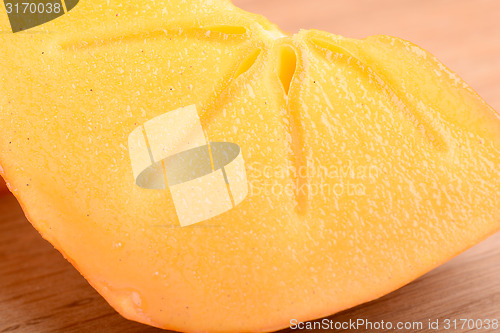 Image of sharon kakis sliced - japanese persimmons close up