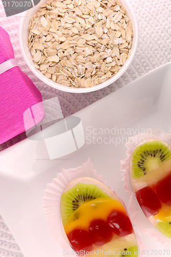 Image of sweet cake on white plate and fruits