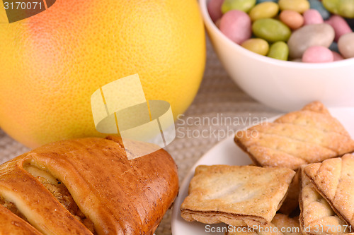 Image of sweet cake on white plate and fruits