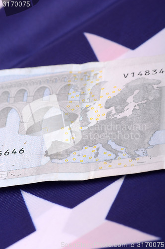 Image of european money on american flag