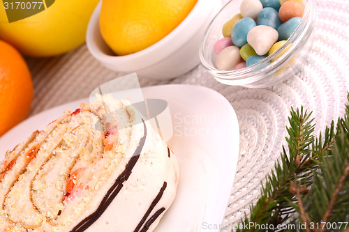 Image of sweet cake on white plate and fruits