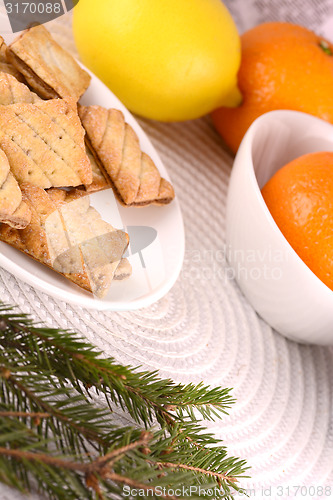 Image of sweet cake on white plate and fruits