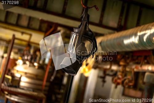 Image of Gasmask hanging from cieling