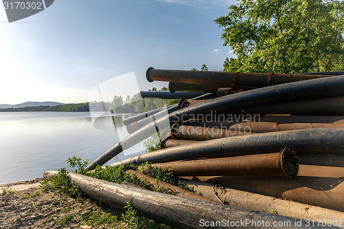 Image of Rusty metal pipes in the forest