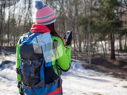Image of Hiker tracks his position at the gps