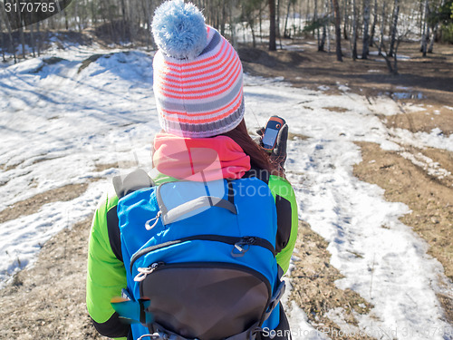 Image of Hiker tracks his position at the gps