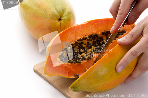 Image of Papaya Cut In Half Along Its Longitudinal Axis