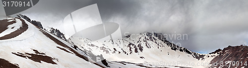 Image of Panorama of snowy mountains before rain