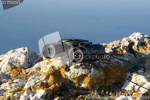 Image of Binoculars on the rock