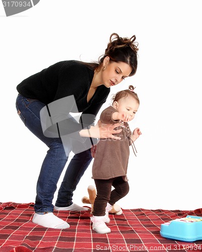 Image of Mother catching little daughter.