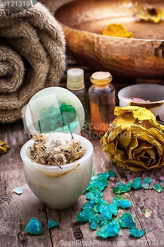 Image of bronze bowl with water and accessories spa treatments