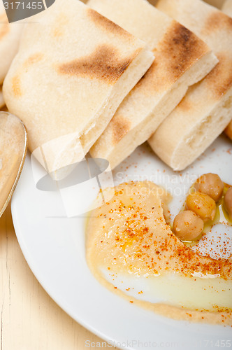 Image of Hummus with pita bread 