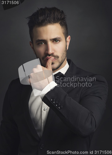 Image of Latin man wearing a tuxedo