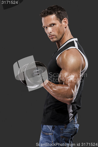 Image of Muscle man lifting weights