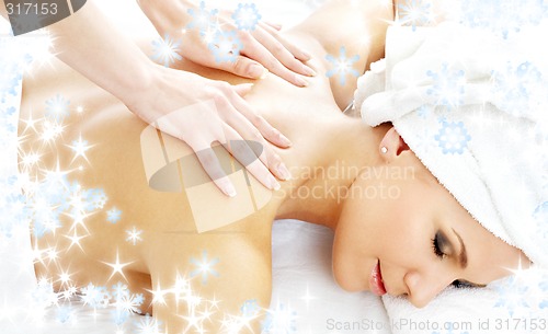 Image of professional massage with snowflakes #2