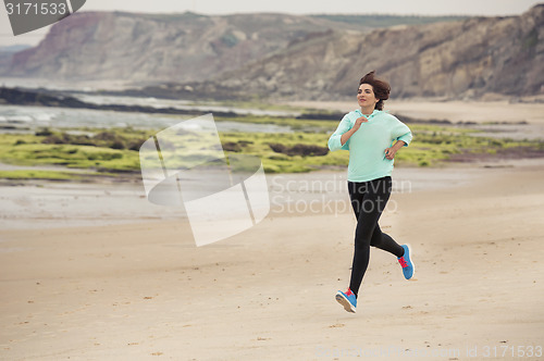 Image of Beautiful woman running