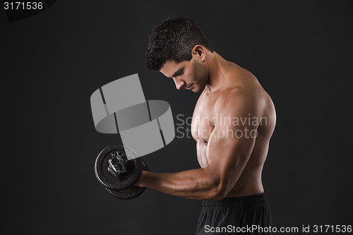 Image of Muscular man lifting weights